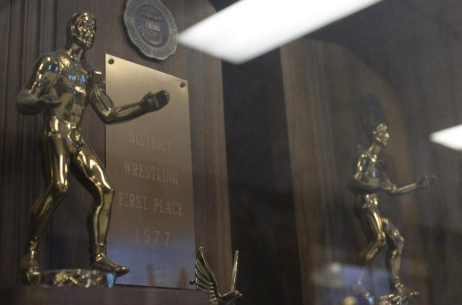 The wrestling trophies sit in the trophy case for all to see
