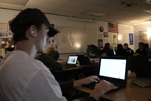 Senior Josiah Hanly writing his admissions essay.